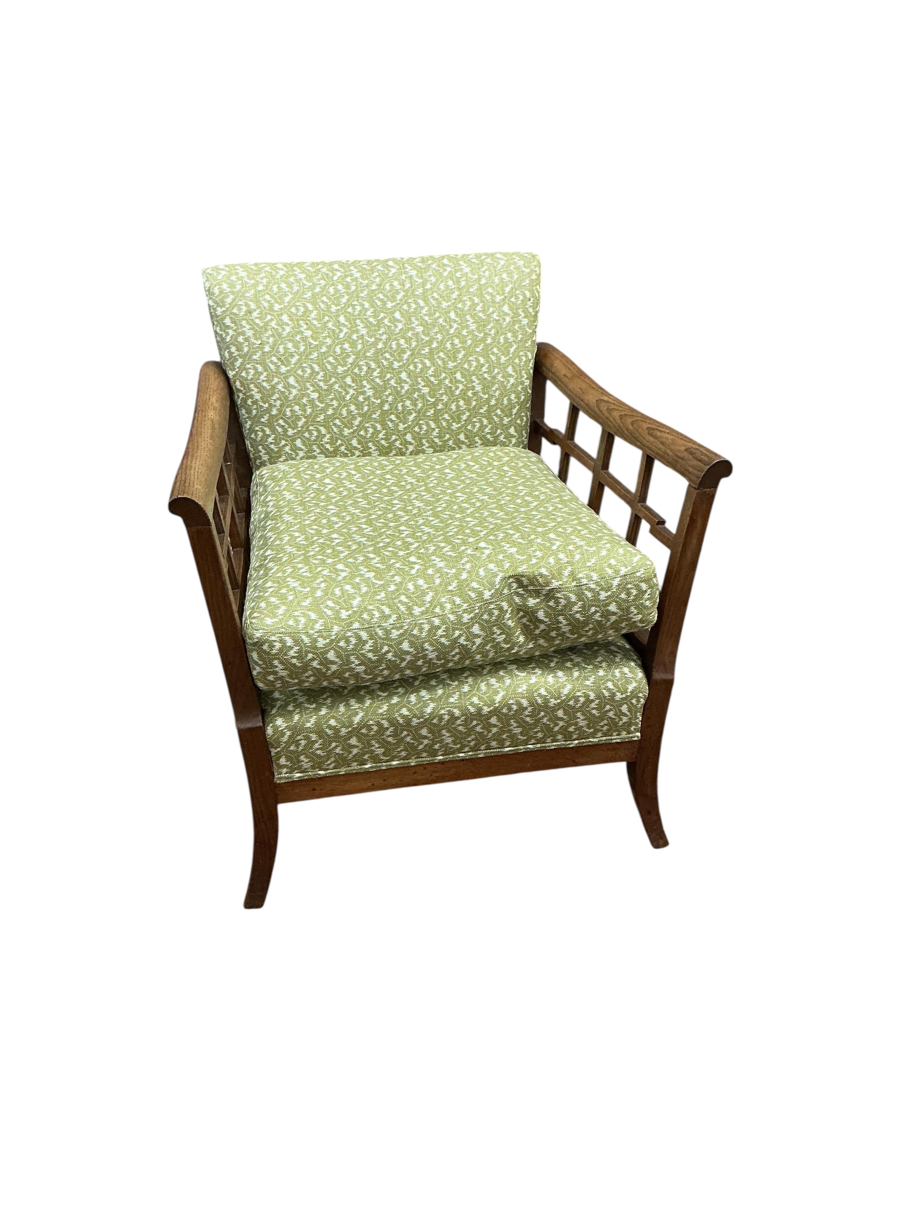 A 1920's oak framed armchair, width 72cm, depth 74cm, height 78cm